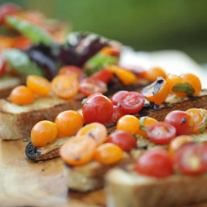 Cherry Tomatoes are grilled bread with 2 types of basil