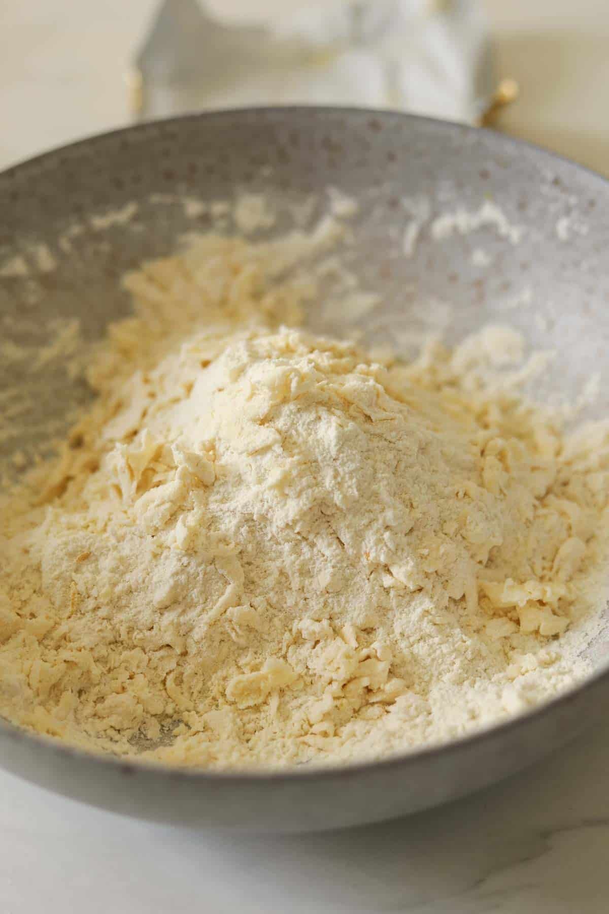 Butter and dry ingredients combined into a coarse meal.