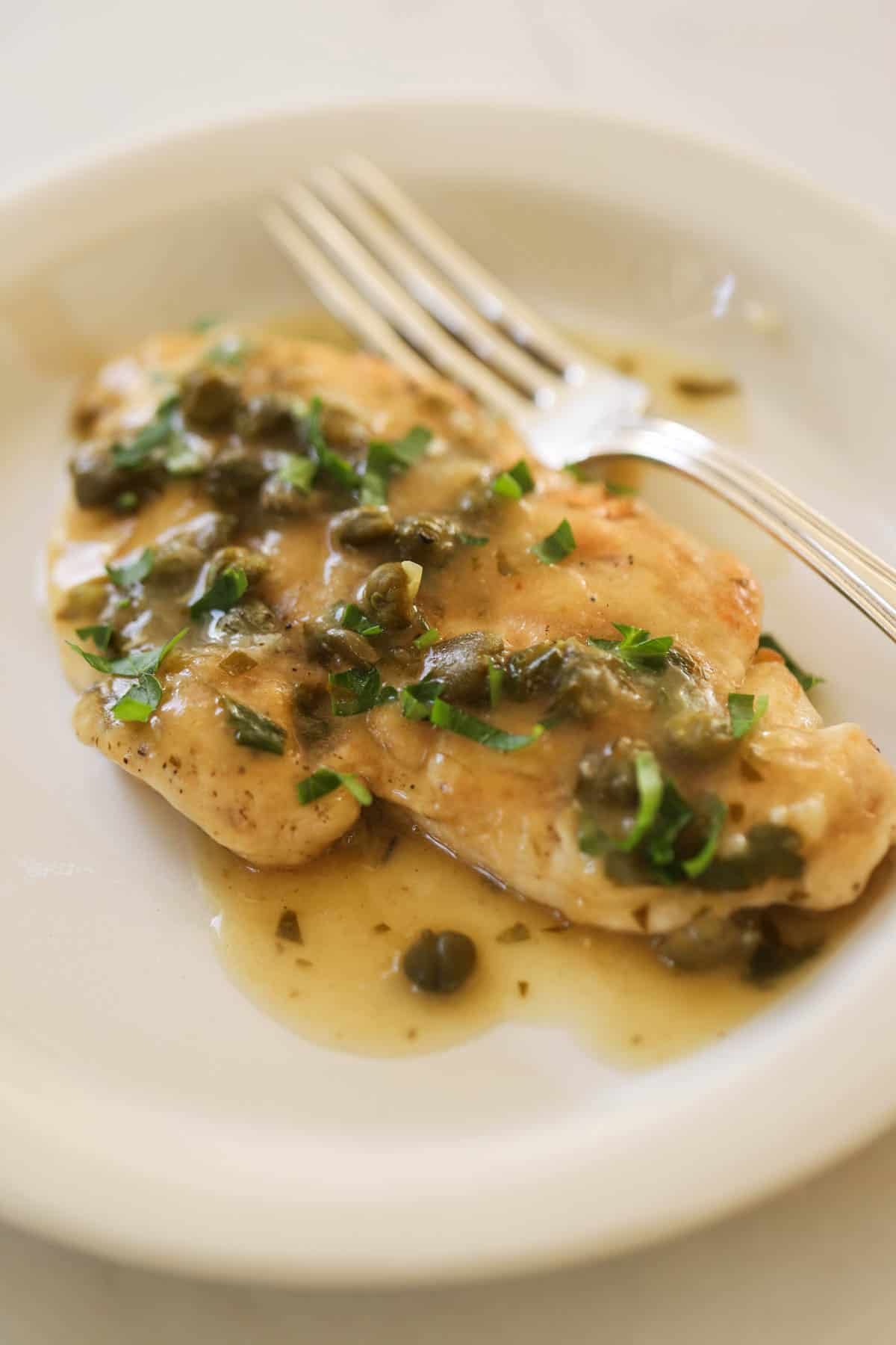 a serving of Chicken Piccata on a plate.
