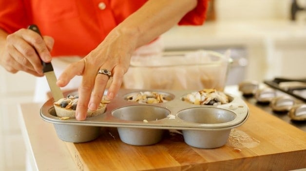 Assembling oatmeal cups in muffin tins