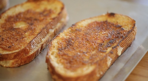 toasted grilled cheese sandwiches on a baking tray