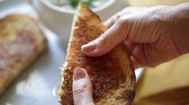 Holding Crispy grilled cheese sandwich
