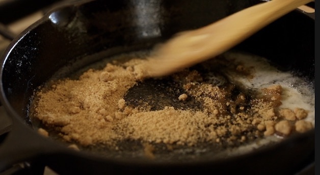 Brown sugar and butter in a cast-iron skillet