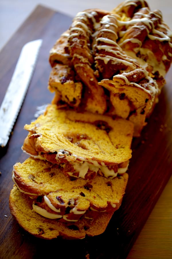 Pumpkin Cinnamon Roll Loaf on Board sliced open