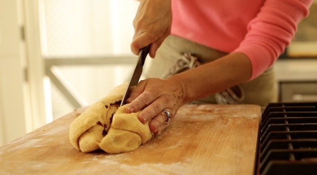 slicing log of dough