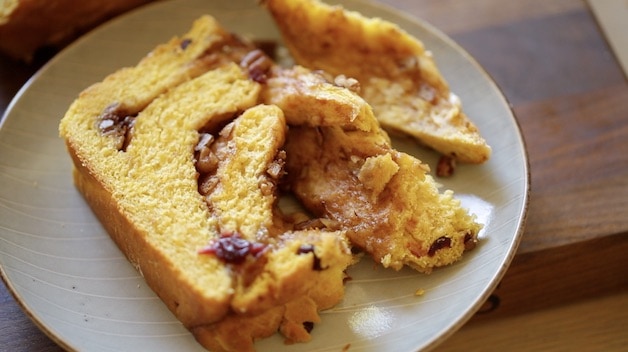 slice of pumpkin cinnamon roll loaf on plate