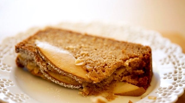 a slice of spiced pear cake on a plate