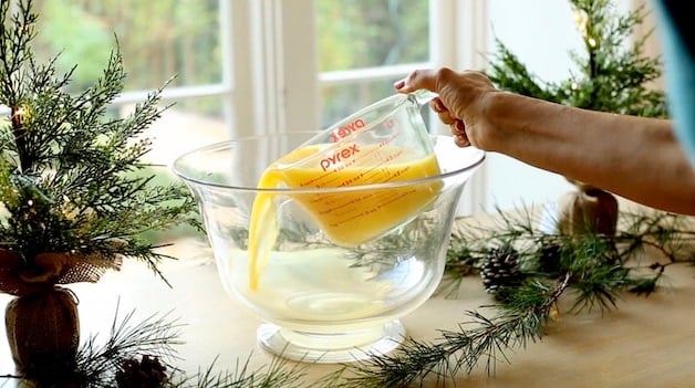 Pouring Orange Juice into a Punch Bowl