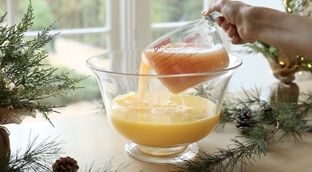 Adding Grapefruit Juice to Orange Juice in a Punch Bowl