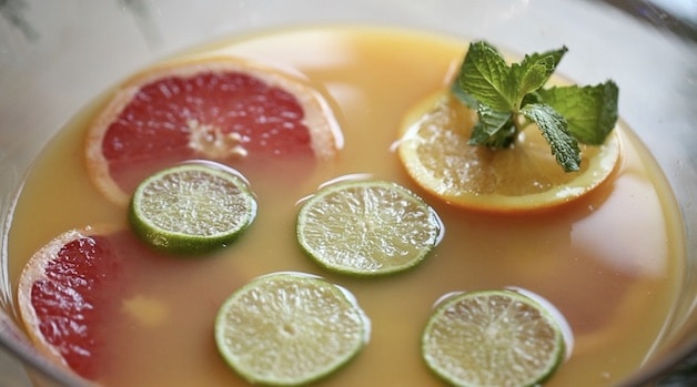 Citrus floating in Punch Recipe with Fresh Mint in Orange Wheel