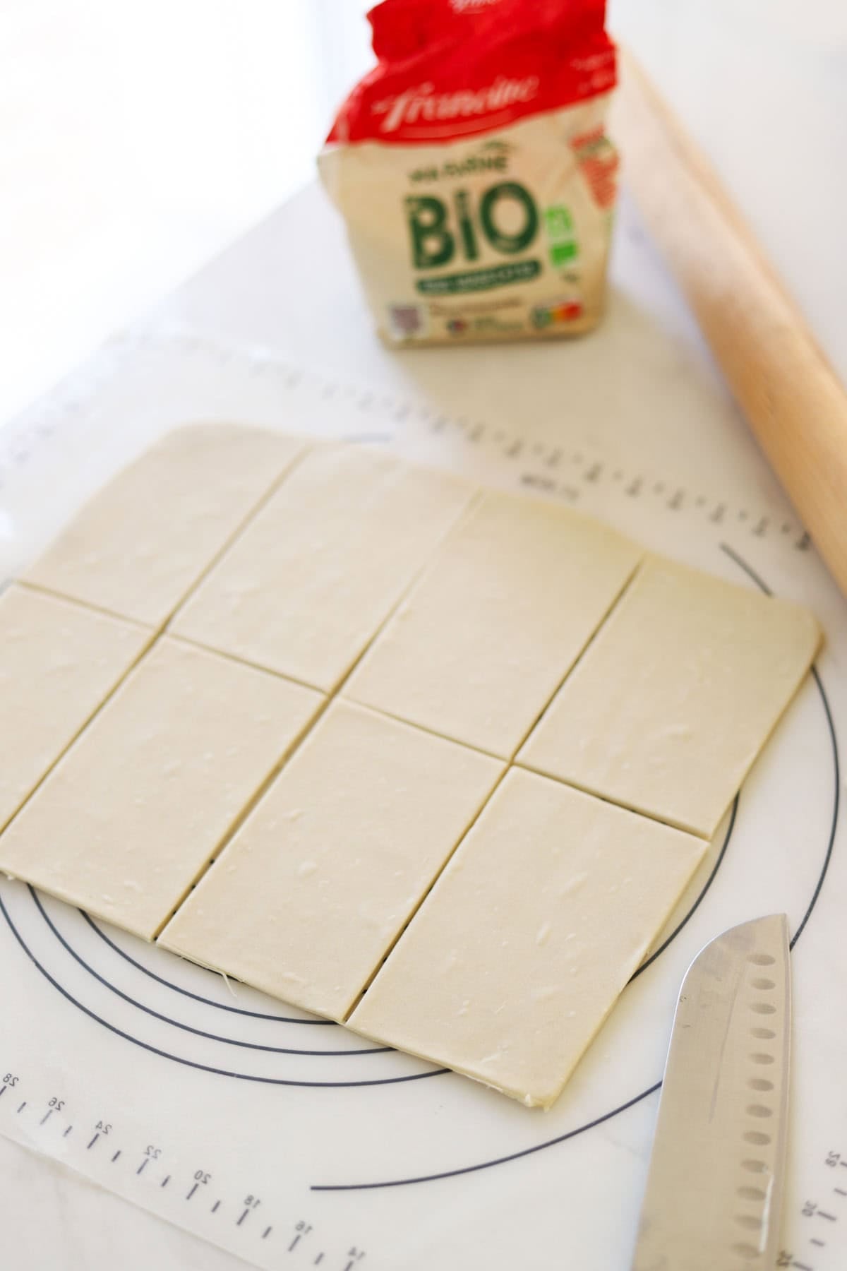 a rectangle piece of puff pastry cut into 8 rectangles.