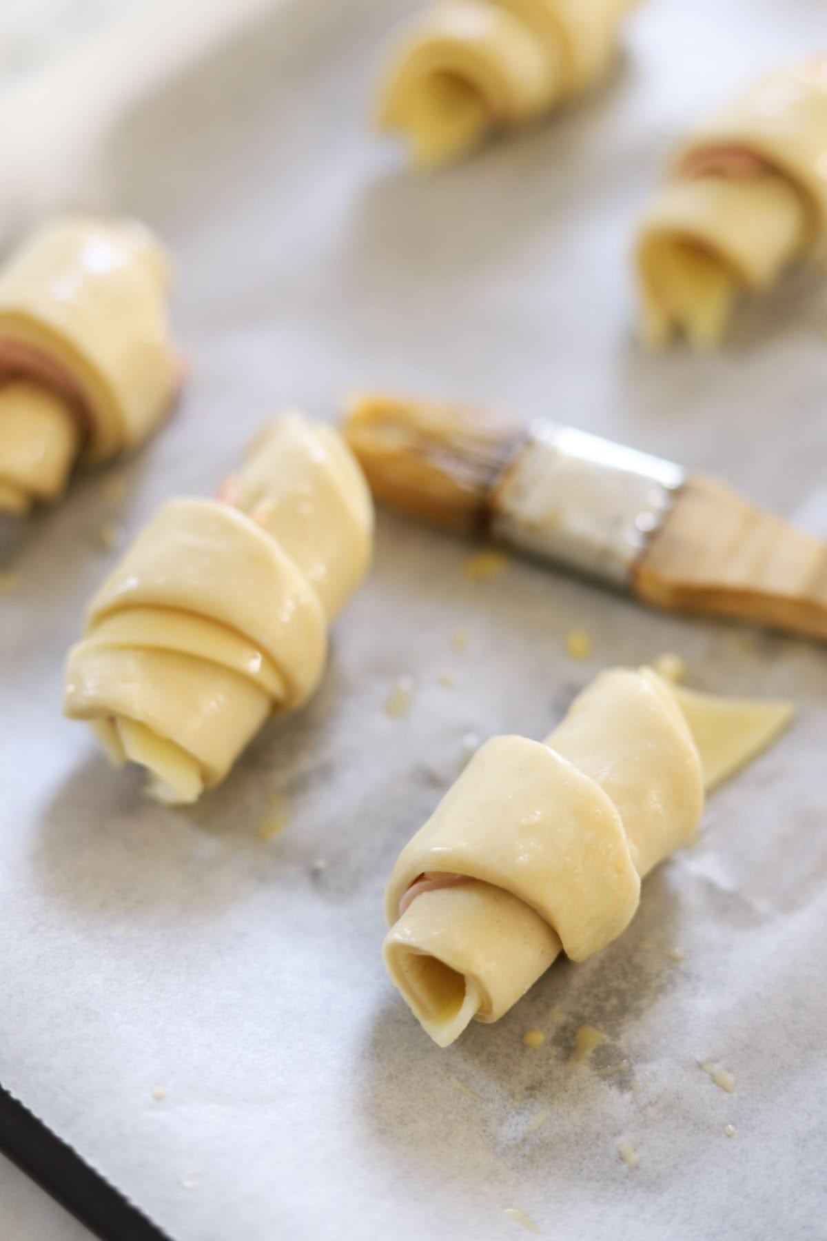 Croissants ready to be washed with egg wash.