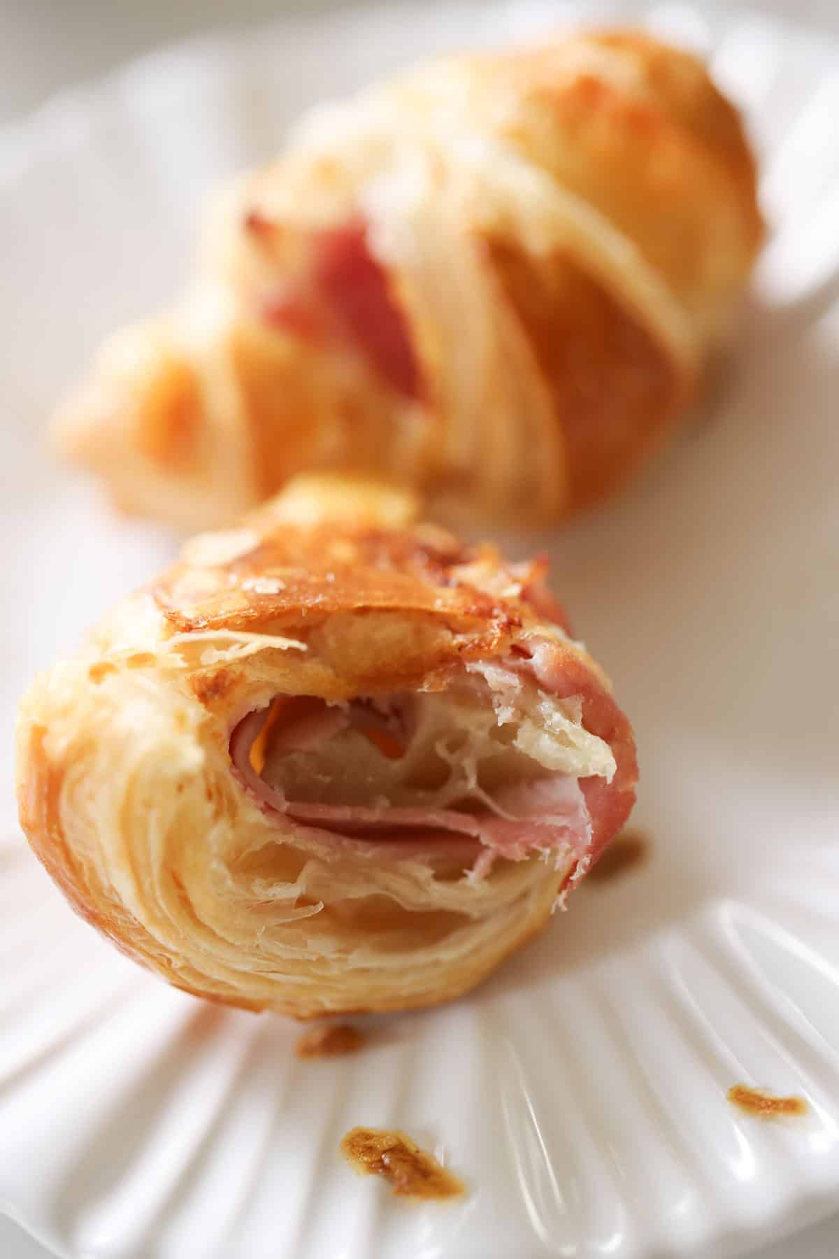 Interior of a mini croissant to show the layers of flakiness.