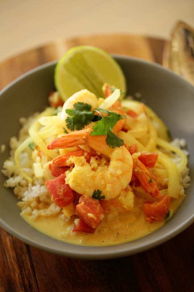 Vertical Image of shrimp curry in a bowl with cauliflower rice