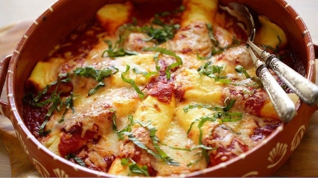 Cheese Manicotti in a terra cotta dish