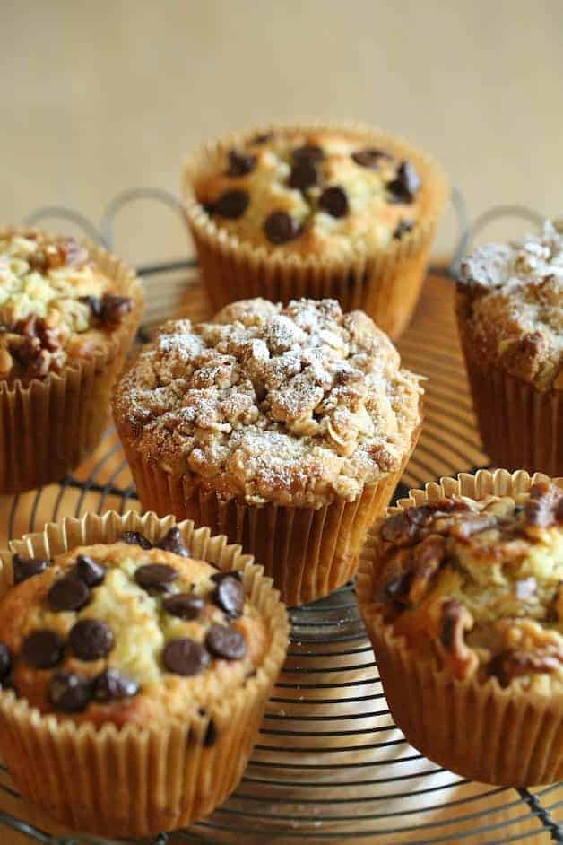 a selection of banana muffins with walnuts, chocolate chips and crumb topping