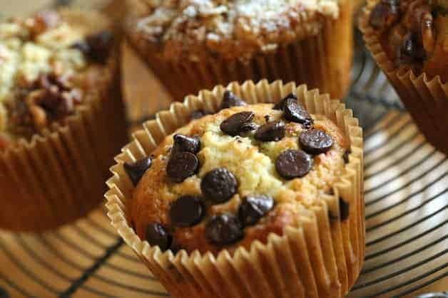 a banana chocolate chip muffin in a parchment wraper