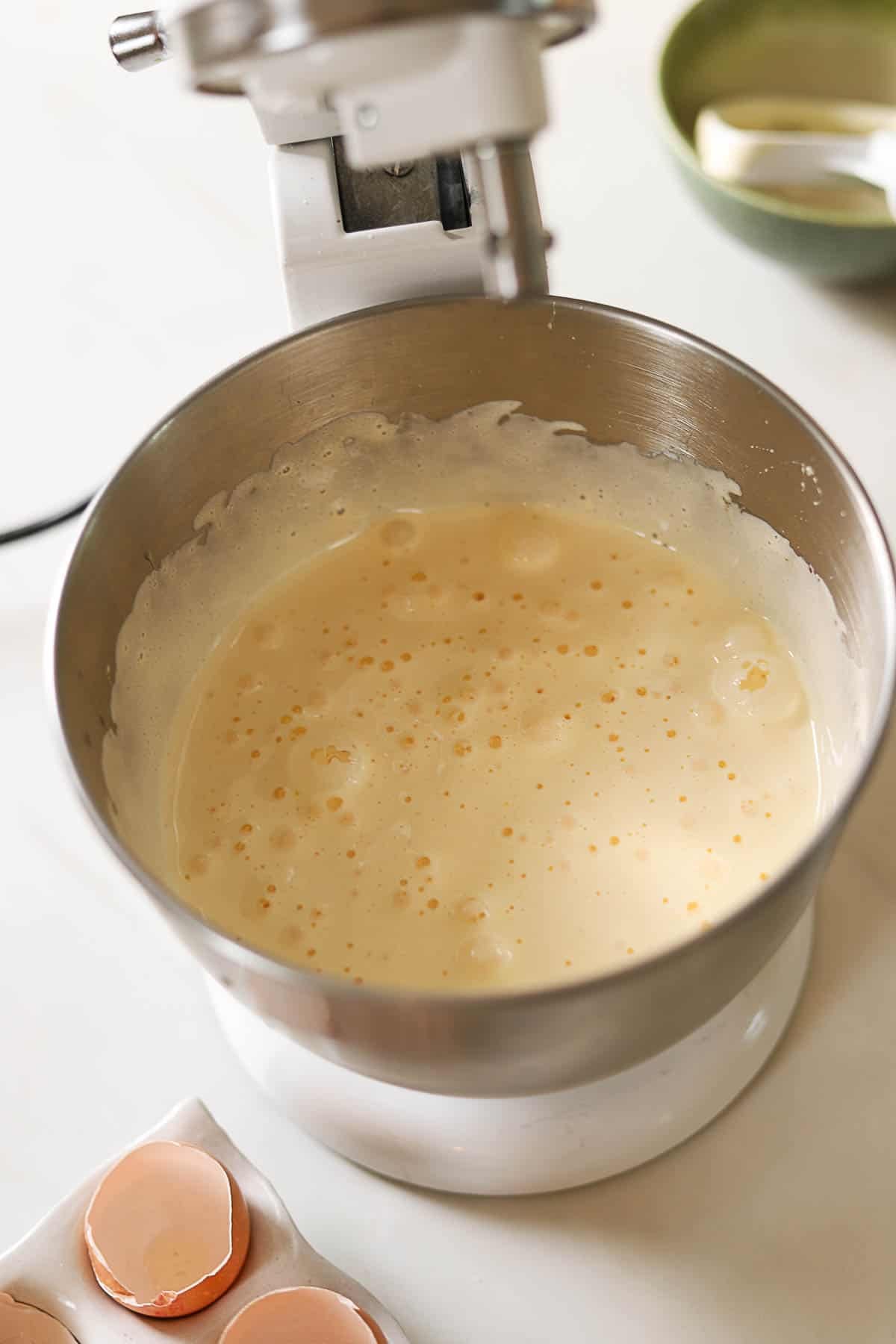 Beaten eggs and sugar in a stand mixer.