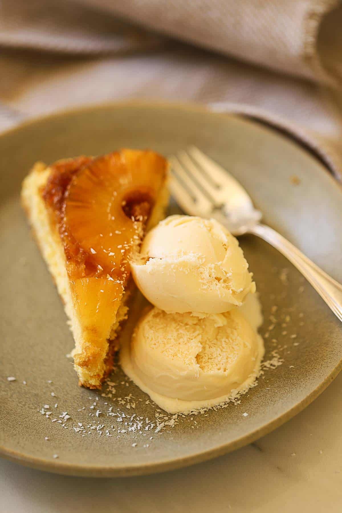 a slice of pineapple cake and coconut ice cream.