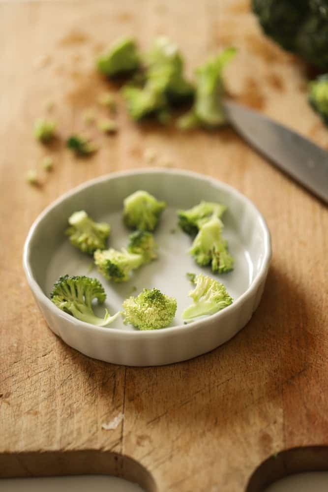 broccoli florets in a small quiche dish.