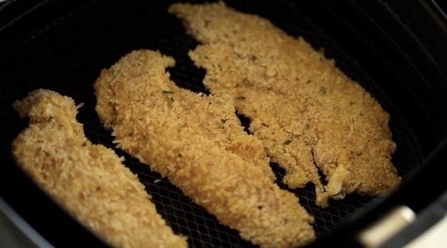 Chicken Tenders raw in air fryer basket