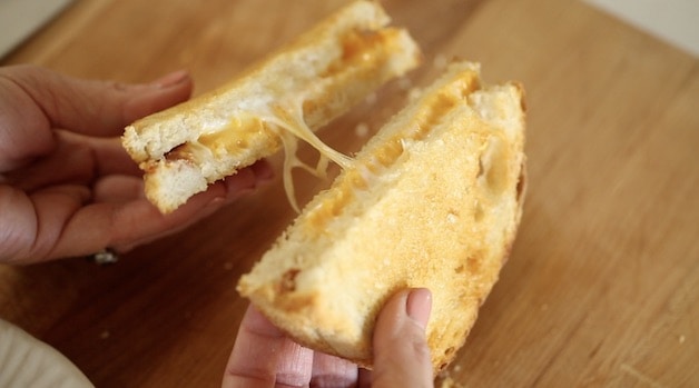 Showing cheese melted in grilled cheese sandwich 