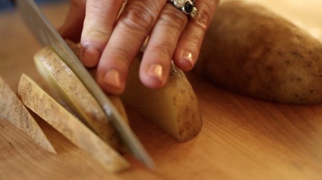 Slicing Potatoes in ⅛" slices
