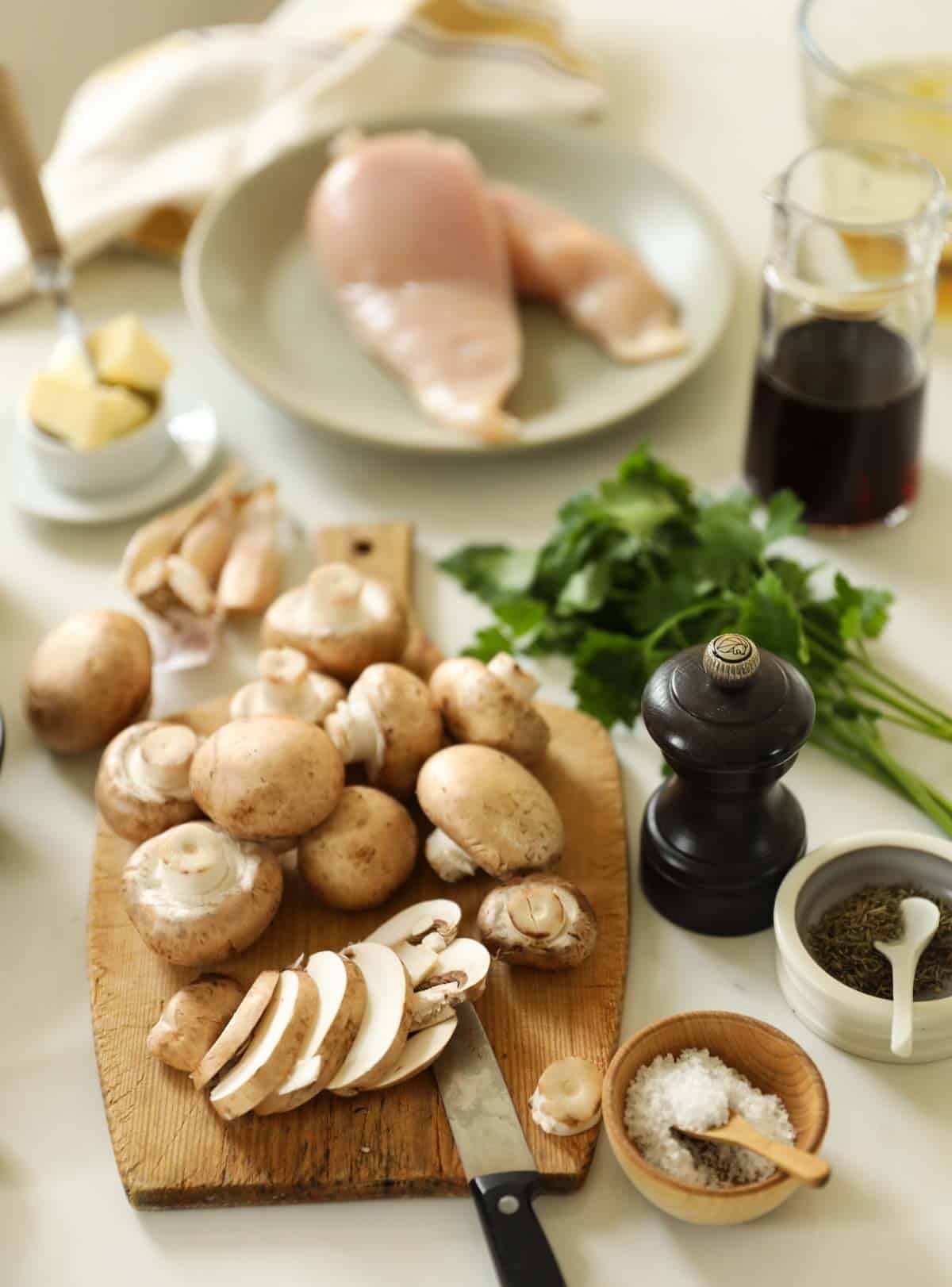 Ingredients for Chicken Marsala laid out on the counter.