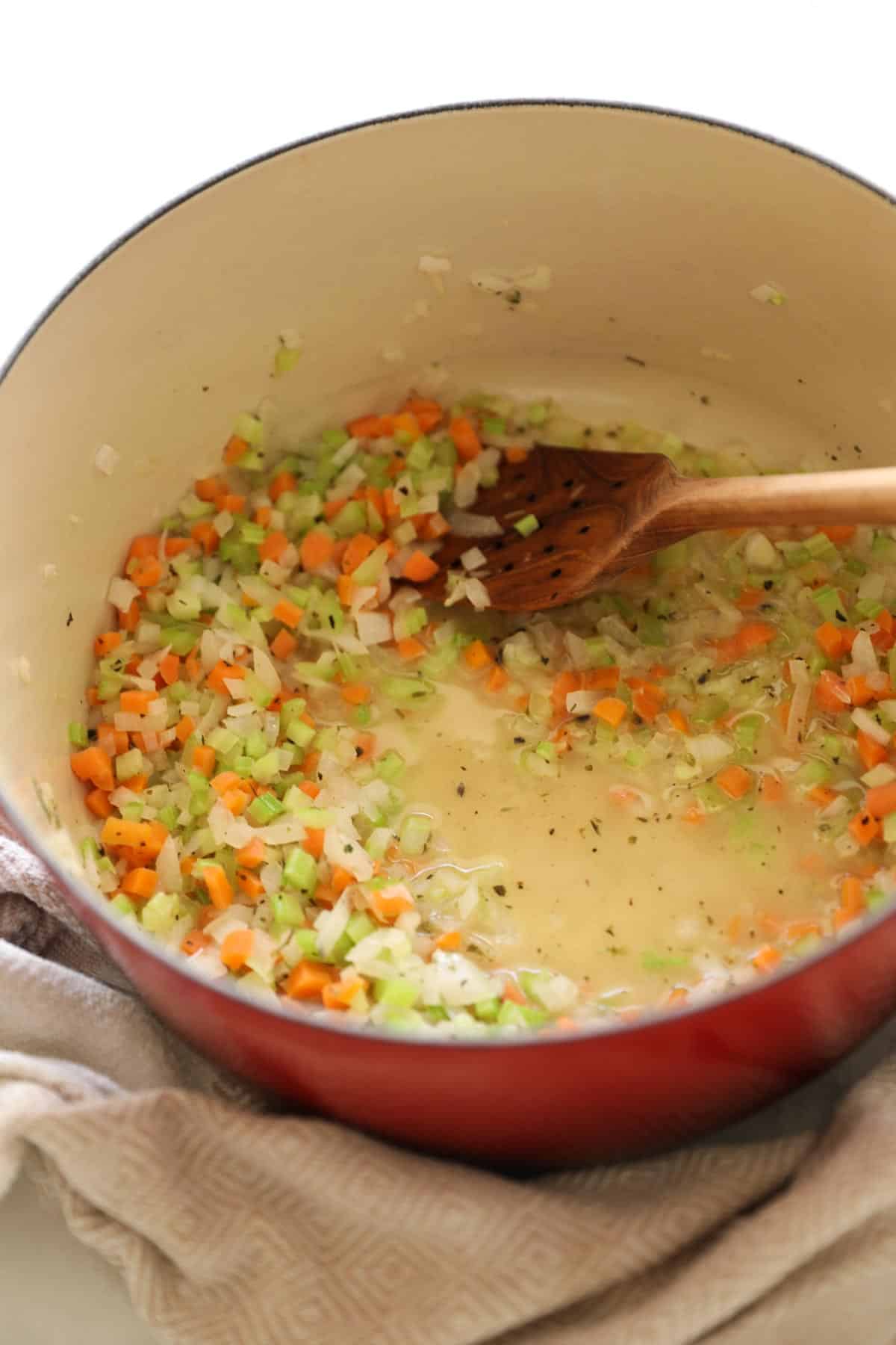 celery, onions and carrots simmered in a pot