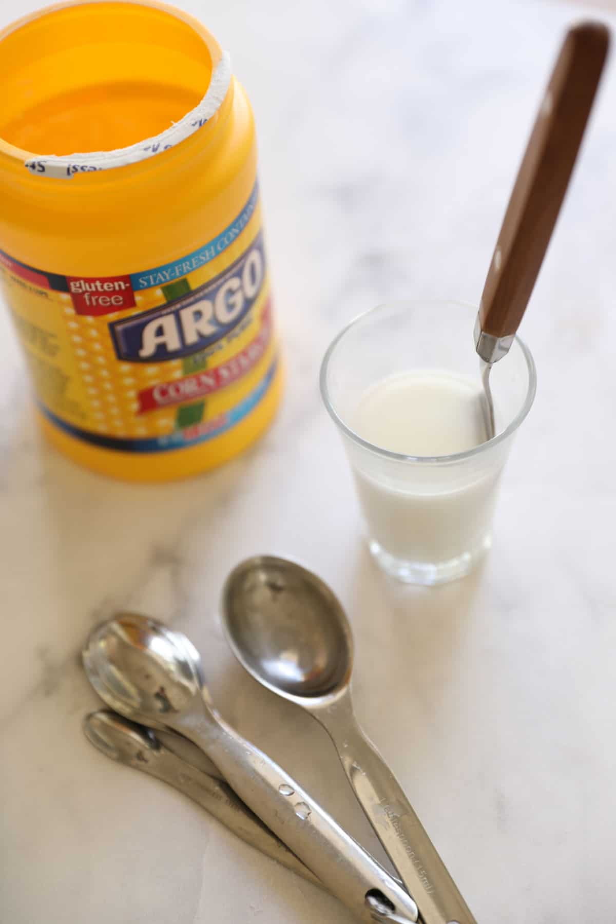 cornstarch and slurry in a glass