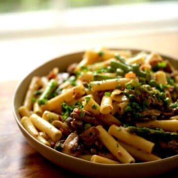 Spring Pasta with Asparagus, Peas and Mushrooms in a Large Serving Bowl