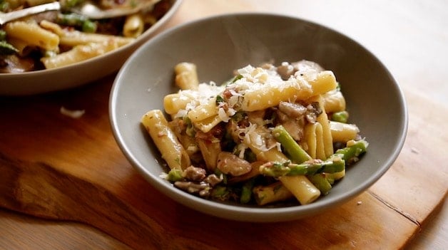 small serving of spring pasta in a gray bowl