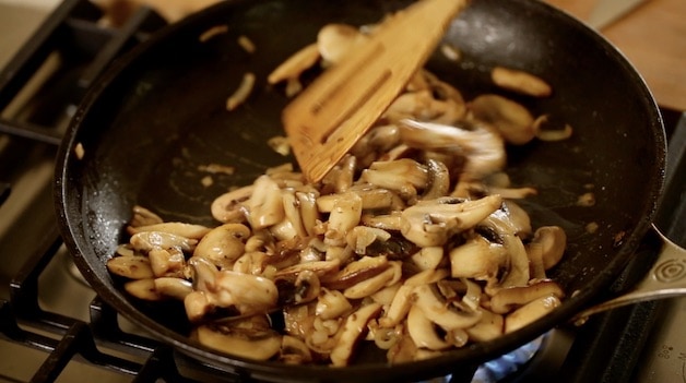 cooking mushrooms down to release their juices in a skillet