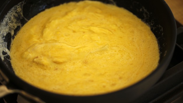 Beaten Eggs setting in a skillet