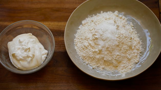 sour cream and dry ingredients in bowls on cutting board