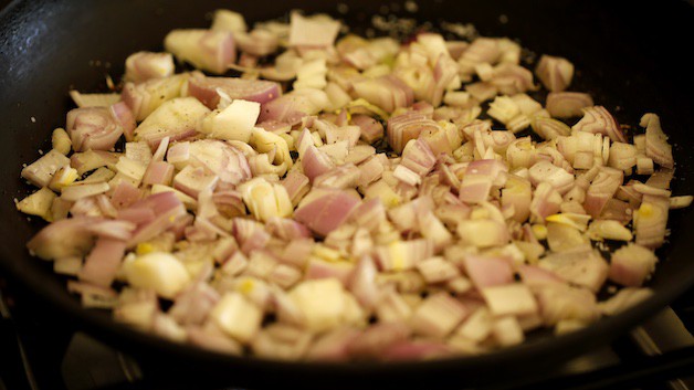 Shallots caramelizing in a pan