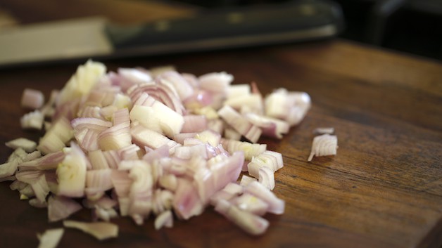 Diced shallots on a cutting board