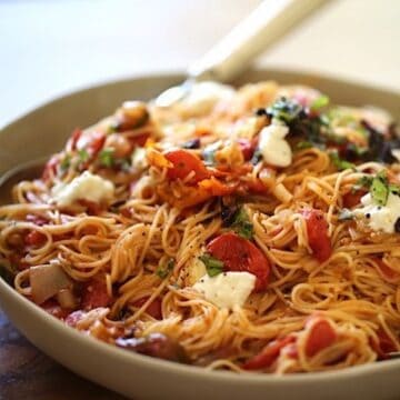 Angel Hair Pasta and Mozzarela and Basil in a large bowl