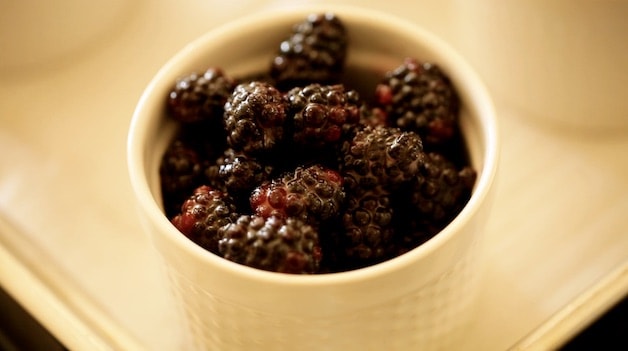 a ramekin filled with blackberries