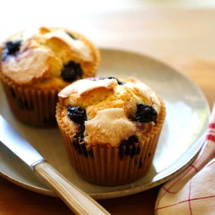 Blueberry Muffins on a plate with a red and white checked napkin