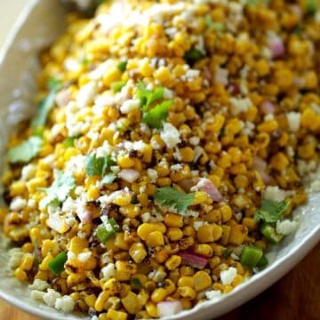 Corn Salad on a platter with cheese and cilantro