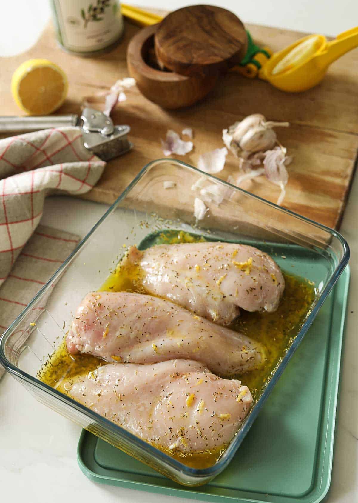 marinade for chicken with chicken breasts marinating.