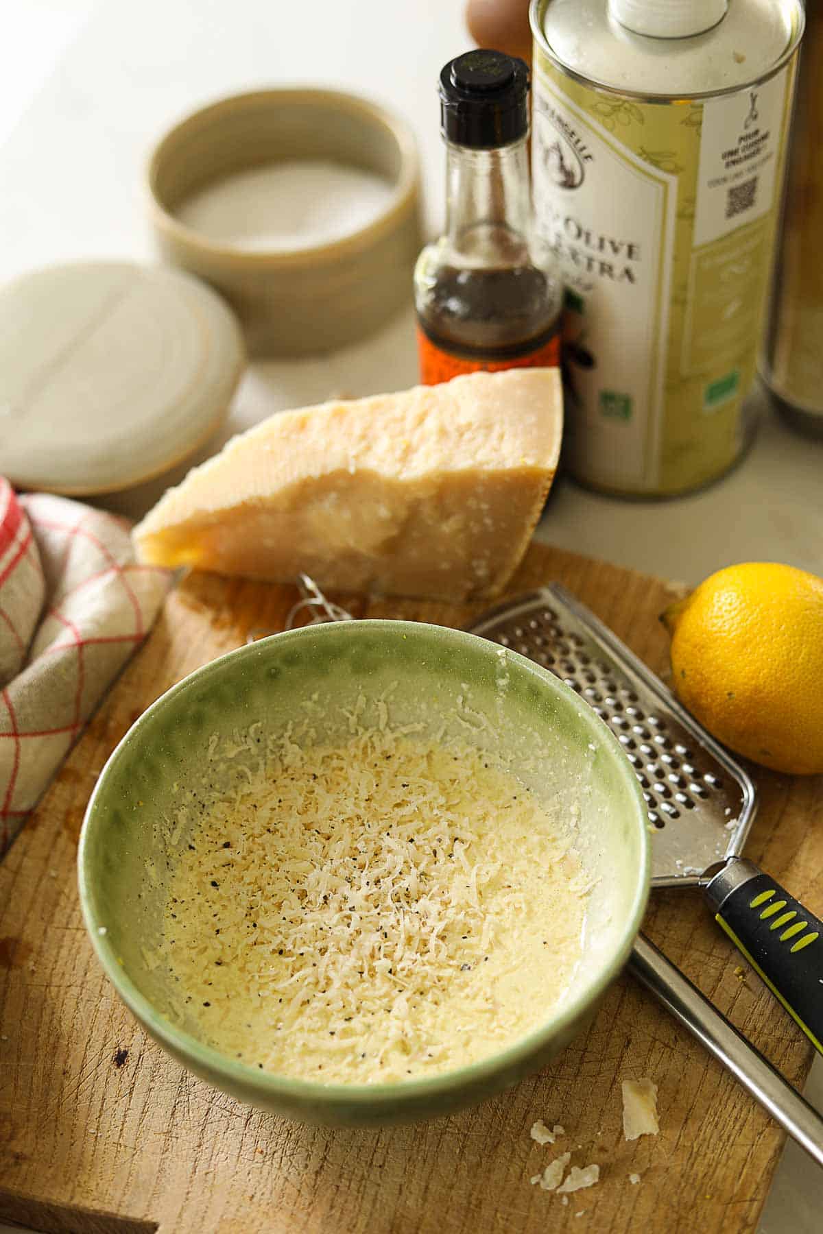 Caesar salad dressing in a bowl with ingredients.