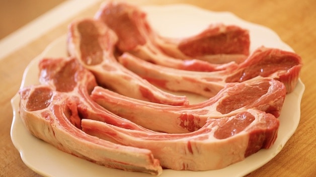 Raw lamb chops on a plate