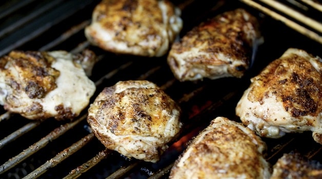 Spiced chicken thighs on grill