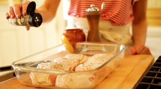 Adding Garam Masala to chicken thighs in Pyrex