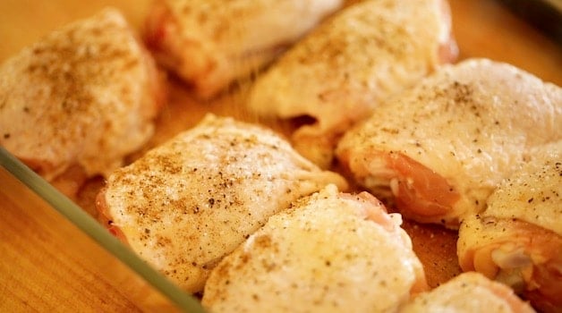 Spiced raw chicken breasts