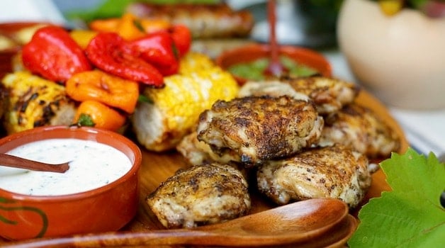 Grilled chicken on a mixed grill platter