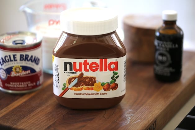 Nutella Jar and other ingredients on cutting board 