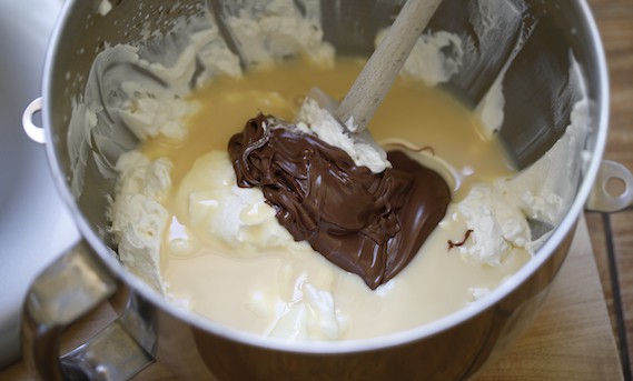 Whipped cream with sweetened condensed milk and Nutella with spatula 